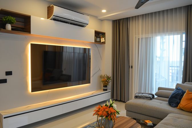 A low-quality photo showing a modern living room with an energy-efficient air conditioning unit installed. A low-quality photo showing a modern living room with an energy-efficient air conditioning unit installed.