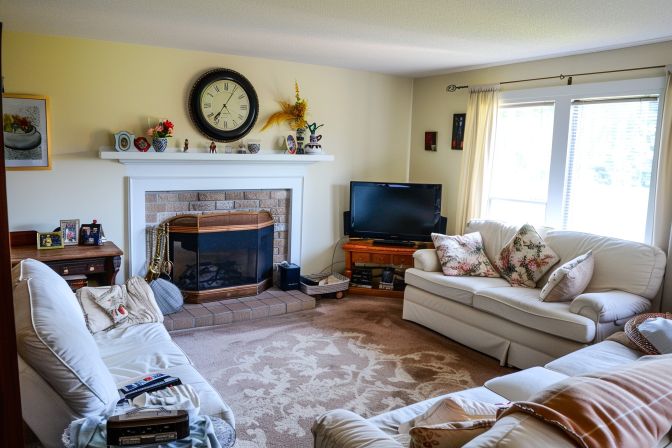 The living room features a programmable thermostat controlling indoor humidity levels. The living room features a programmable thermostat controlling indoor humidity levels.