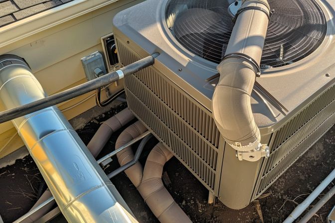 An air conditioning unit undergoing an initial inspection for leaks and blockages. An air conditioning unit undergoing an initial inspection for leaks and blockages.