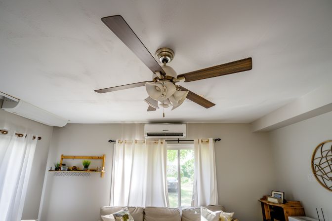 A ceiling fan and split air conditioner provide energy-efficient cooling. A ceiling fan and split air conditioner provide energy-efficient cooling.